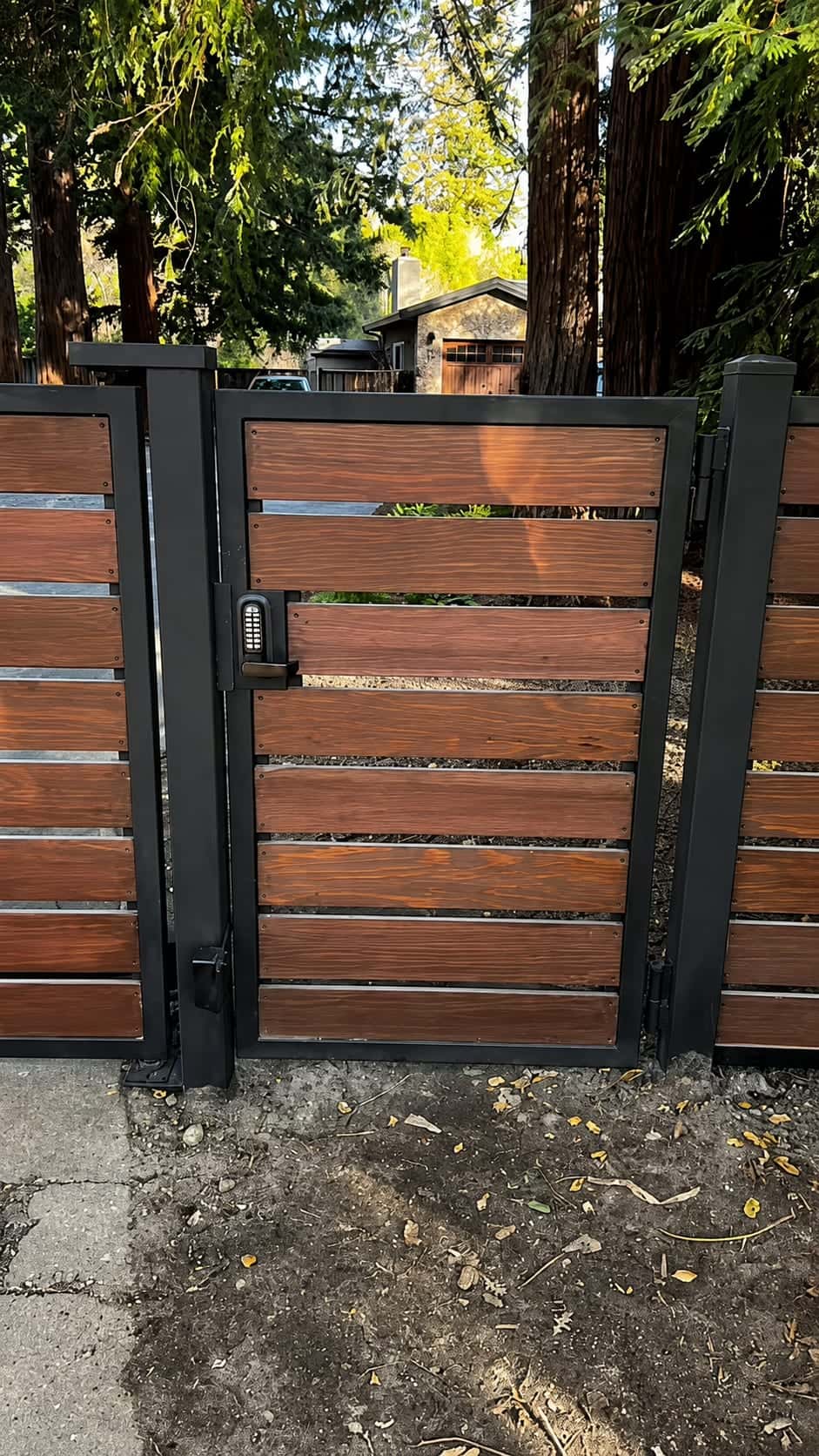 Wood gate with keypad entry and a separate pedestrian access gate