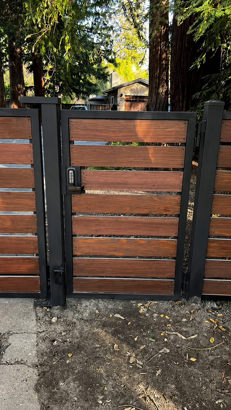 Wood gate with keypad entry and a separate pedestrian access gate
