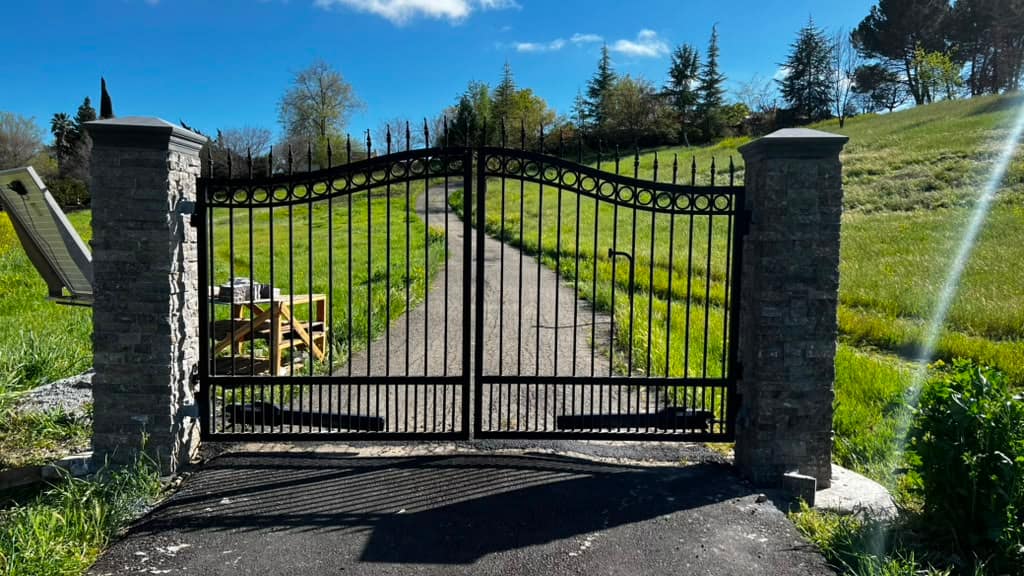 Ornamental iron automatic gate on a Marin County hillside estate driveway